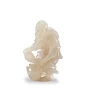 A Chinese agate carving of a standing fisherman, early 20th century