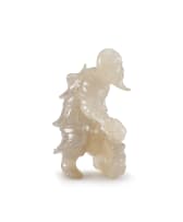 A Chinese agate carving of a standing fisherman, early 20th century