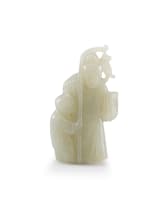 A Chinese jade carving of a fisherman and a small boy, 20th century