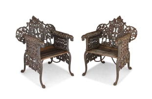 A pair of Indian wrought-iron openwork garden chairs, W. Leslie & Company, Calcutta