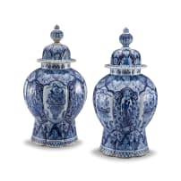 A pair of Dutch Delft vases and covers, 18th/19th century