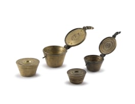 Two sets of brass apothecary nested cup weights, 18th/19th century