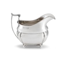 An Edwardian silver milk jug, John Round & Son Ltd, London, 1903