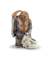 A Japanese Kutani stoneware figure of Putai, early 20th century