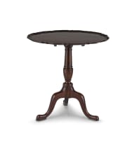 A George III mahogany pie crust tilt-top table