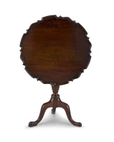 A George III mahogany pie crust tilt-top table