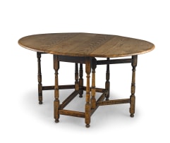A Victorian oak drop-leaf table
