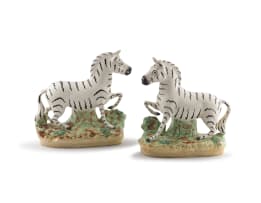 A pair of Staffordshire figures of zebras