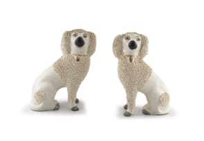 A pair of Staffordshire figures of poodles