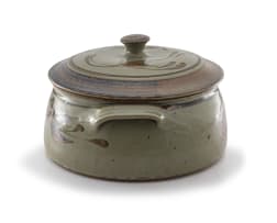 A stoneware casserole dish and cover, Tim Morris, 1941-1990