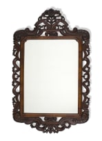 A carved walnut mirror, 19th century