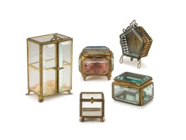 Five gilt-metal and glass jewellery caskets