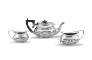 An Edward VII three-piece silver tea service, maker's initials J L & S, Birmingham, 1903, retailed by Davison Bros, 34 Oxford SW