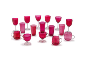 An assembled group of six cranberry and clear-glass wine glasses