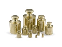 Eleven brass troy ounce weights