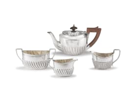 An assembled four-piece Victorian silver tea service, Barker Brothers, Harrison Brothers, Thomas Hayes, Sheffield, Birmingham, 1889-1897