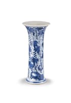 A Chinese blue and white 'squirrel and grape' beaker vase, Qing Dynasty, early Kangxi period (1662-1722)