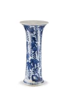 A Chinese blue and white 'squirrel and grape' beaker vase, Qing Dynasty, early Kangxi period (1662-1722)