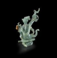 A Chinese carved jade figurine, Qing Dynasty, 20th century