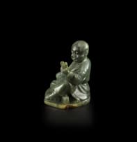 A Chinese carved jade figure, 20th century