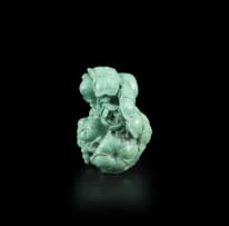 A Chinese carved turquoise figure, 19th century