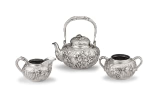 A Chinese Export silver three-piece tea service, maker possibly Zhong Guang, Canton, late 19th/early 20th century