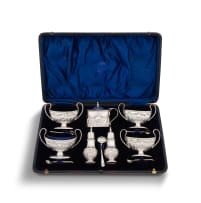 Edwardian silver cased condiment set, Henry Matthews, Birmingham, 1902 and spoons Francis Higgins III, London, 1884