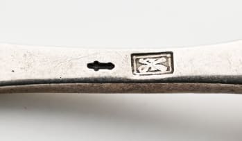 A set of twelve Dutch silver spoons with sugar scoop, Netherlands, .833 standard, early 20th century