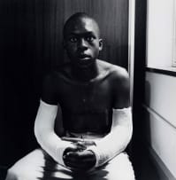 David Goldblatt; Fifteen-year-old Lawrence Matjee after his assault and detention by the Security Police, Khotso House, De Villiers Street