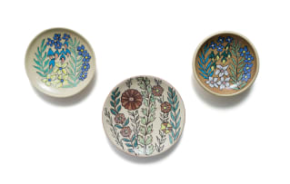 Kalahari Studio; Small plates decorated with floral design, three