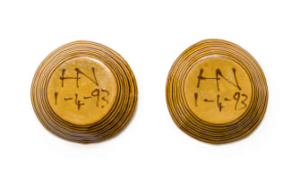 Hylton Nel; A pair of yellow dishes with brown fish motif, two