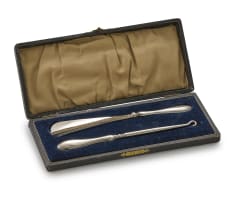 A George V silver shoehorn and button hook, maker's mark worn, Birmingham, 1912