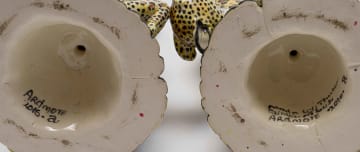 Thulani Mntungwa and Mbusi Mfuphi; A pair of candlesticks with leopard and floral decoration, two