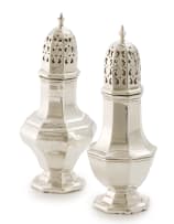 A near pair of Edward VII and George V silver sugar casters, Walker & Hall, Sheffield, 1905 and 1930
