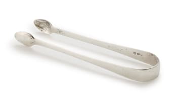 A pair of berry spoons and sugar tongs, makers and date marks indistinct, London
