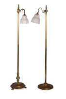 Near pair of brass standing lamps with glass shades, 19th century