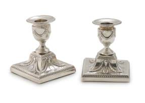 A near pair Victorian silver candlesticks, Hawksworth Eyre & Co Ltd, Sheffield 1899 and 1900