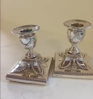 A near pair Victorian silver candlesticks, Hawksworth Eyre & Co Ltd, Sheffield 1899 and 1900