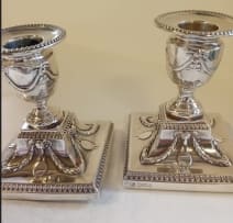 A near pair Victorian silver candlesticks, Hawksworth Eyre & Co Ltd, Sheffield 1899 and 1900