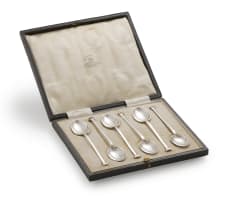 A set of six George V silver teaspoons and six Walker and Hall Apostle forks, Sheffield 1915