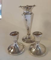 A Victorian silver vase, James Deakin & Sons, Chester, 1899; and a pair of Elizabeth II silver candlesticks, Sanders & Mackenzie, Birmingham, 1973