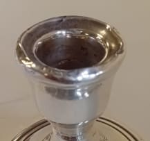A Victorian silver vase, James Deakin & Sons, Chester, 1899; and a pair of Elizabeth II silver candlesticks, Sanders & Mackenzie, Birmingham, 1973