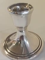 A Victorian silver vase, James Deakin & Sons, Chester, 1899; and a pair of Elizabeth II silver candlesticks, Sanders & Mackenzie, Birmingham, 1973
