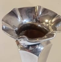 A Victorian silver vase, James Deakin & Sons, Chester, 1899; and a pair of Elizabeth II silver candlesticks, Sanders & Mackenzie, Birmingham, 1973