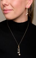 Pearl and diamond pendant and earrings en suite
