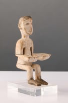 Ewe seated shrine figure with open hands, Ghana