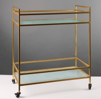 Two-tiered glass and gold-framed trolley on castors