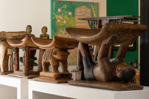 Ashante stool with supportive figure, Ghana