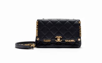 Chanel; A Limited Edition Black Lambskin Paris Monaco Mini Flap Bag in with Antique Gold-Tone Hardware
