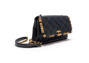 Chanel; A Limited Edition Black Lambskin Paris Monaco Mini Flap Bag in with Antique Gold-Tone Hardware